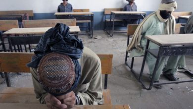 A group of men detained for suspected taliban activities are held for questioning at a schoolhouse in the village of kuhak