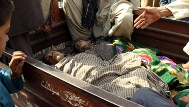 Relatives And Members Of Civilians Sit Next The Dead Bodies Of Children Who Were Killed During Clashes Between Afghan Security Forces And The Taliban In Kunduz, Afghanistan
